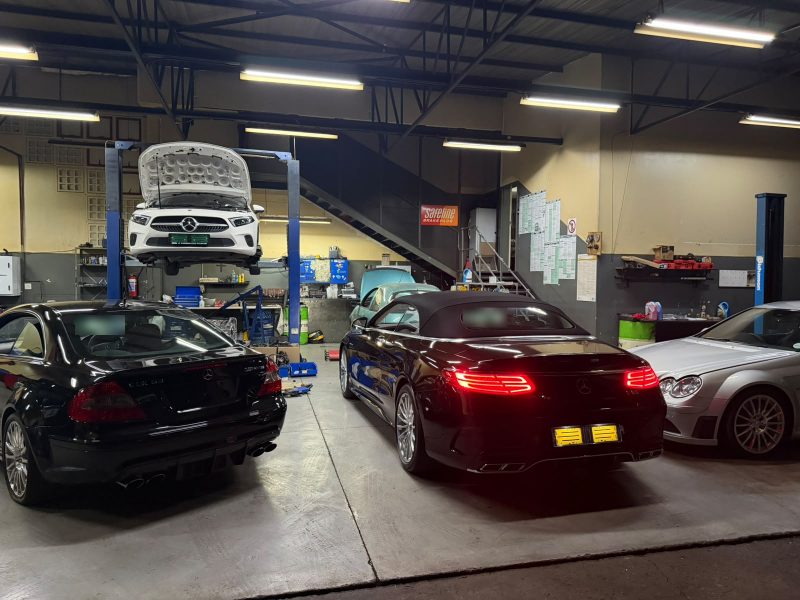 Two Mercedes-AMG CLK63 Black Series and an S65 cabriolet in the Q&A Auto Repairs workshop